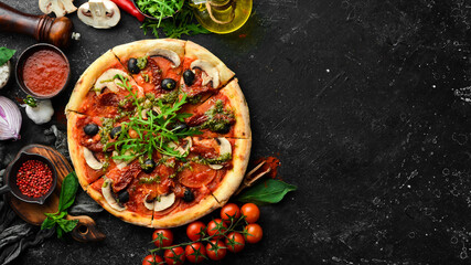 Homemade pizza with sun-dried tomatoes, mushrooms and olives. Italian cuisine. Food delivery.