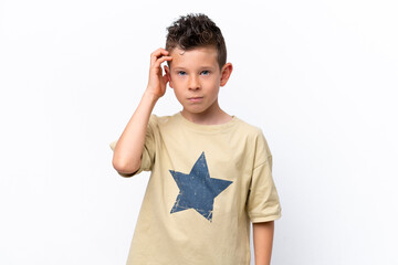 Little caucasian boy isolated on white background with an expression of frustration and not understanding