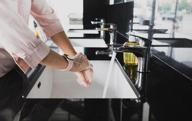 Wash hands with soap and clean water. Protection bacteria by washing hands frequently. Health care concept