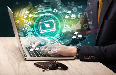 Business hand typing on a modern laptop