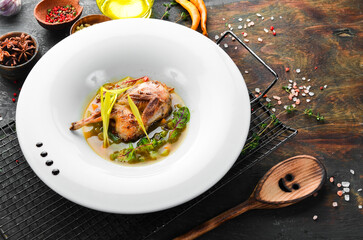 Quail meat soup with vegetables and spices. Restaurant menu. top view. Free space for text