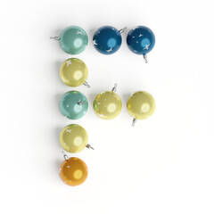 Capital letter F from christmas balls. Christmas or New Year font made from christmas toys. 3d render. White background. Winter font. Lettering design element. Bright festive font