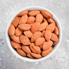Nuts. Almond nut on a stone background. Top view. Free space for text.