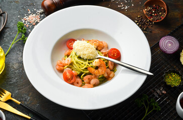 Pasta with shrimp, cheese and pesto sauce. Italian cuisine. Menu. Top view.