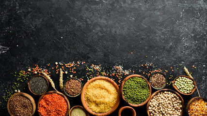 Various cereals and legumes: rice, peas, lentils, beans, mung beans, buckwheat, chia, corn and chickpeas. Top view. Banner in the title of the site