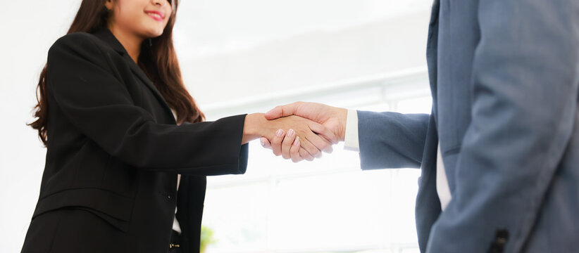 Business deal agreement concept, Businessman and businesswoman handshake commit on business contract deal