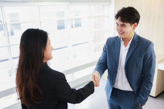 Business deal agreement concept, Businessman and businesswoman handshake commit on business contract deal