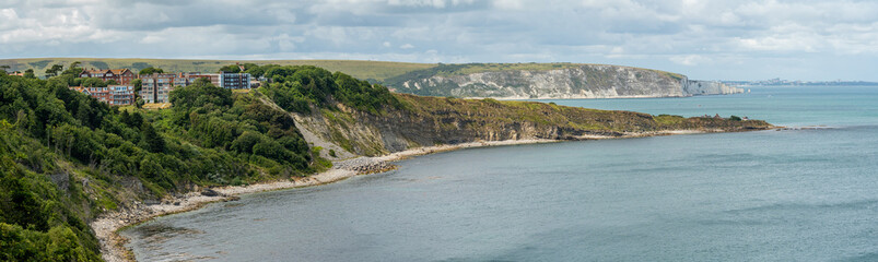 Panorama of coastal town of Swanage, view of Peveril point and Old Harry rocks - obrazy, fototapety, plakaty