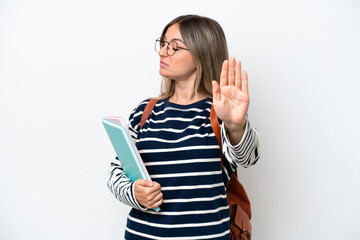 Naklejka premium Young student Rumanian woman isolated on white background making stop gesture and disappointed