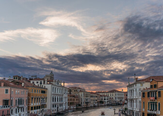 Fototapeta na wymiar Incredible sunset, clouds and traditional venetian architecture seen from the grand canal in Venice, Italy