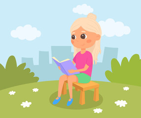Girl sitting on a bench and reading a book. Blond schoolgirl in the park. Kid in summer garden.