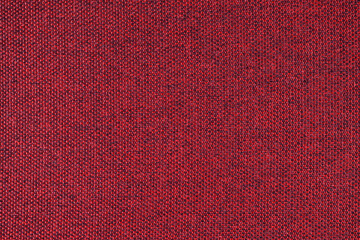 Fototapeta premium Close-up texture of natural red coarse weave fabric or cloth. Fabric texture of natural cotton or linen textile material. Blue canvas background. Decorative fabric for upholstery, furniture, walls