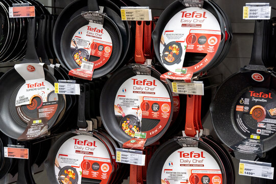 Tyumen, Russia-April 14, 2021: Tefal frying pan display in a large hypermarket. Sale of kitchen utensils