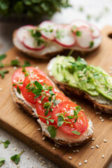 Different sandwiches with vegetables and microgreens