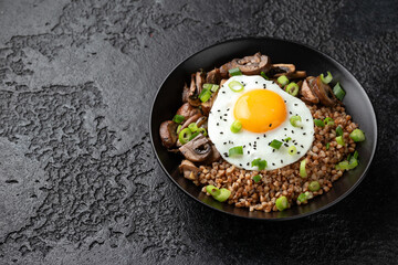 Bowl of Buckwheat with mushrooms, onion and egg. Healthy food