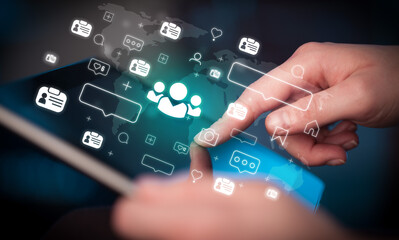 Close-up of a hand using tablet, social media concept