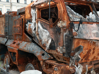 Destroyed Russian armored vehicle. Rusty armor of military equipment. Military conflict in Ukraine 2022