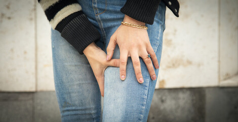 Caucasian woman suffering from knee pain.