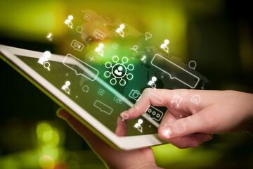 Close-up of a hand using tablet, social media concept