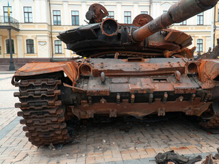 Destroyed Russian tank. Rusty armor of military equipment. Military conflict in Ukraine 2022