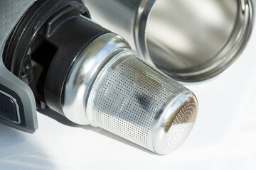 Stainless steel tea strainer infuser. Tool for thermos or travel mug with spill proof lid.