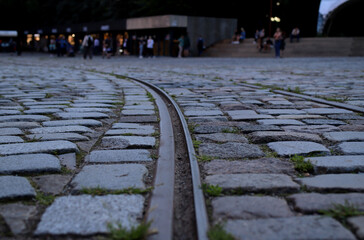 tram railway surrounded by old stone paving stones