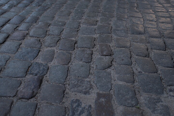old city street lined with stone cobblestones