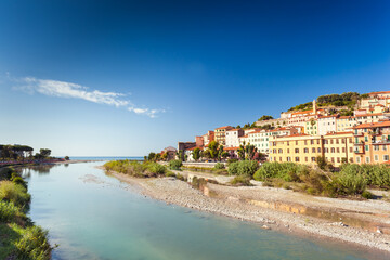 Fototapeta na wymiar Colorful houses of Ventimiglia near river mouth Roya