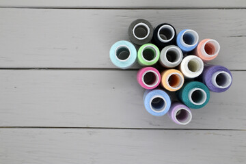 A set of colored threads for hand sewing. View from above