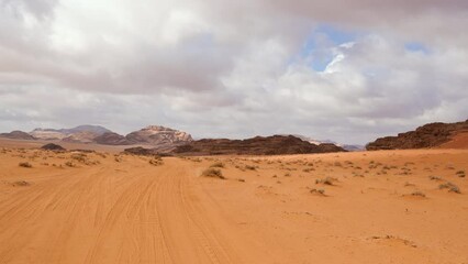 Driving thorugh Wadi Rum desert, stabilized view looks like flying over landscape