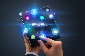 Businessman holding a foldable smartphone