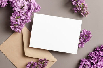 Blank wedding invitation card mockup with spring lilac flowers © nikavera
