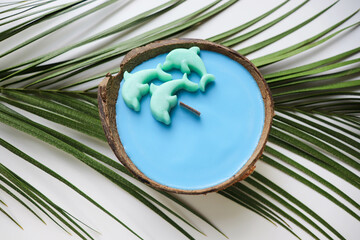 original handmade soy wax candle in coconut, palm branch and sea shells