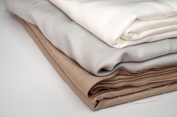 Fototapeta na wymiar Closeup shot of a pile of folded cotton fabric