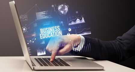 Businessman working on laptop, business concept