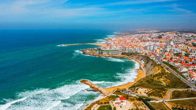 Drone aerial view over beaches, coastlines in Ericeira, Portugal, on summer sunny day. Aerial view to the Beautiful European touristic town. Beautiful cityscape with skyline, ocean rocky shore