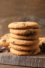 Delicious chocolate chip cookies on wooden table