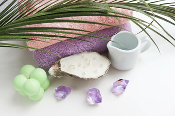 spa theme. pastel colored towels, aroma candles, massagers and spa accessories