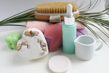 spa theme. pastel colored towels, aroma candles, massagers and spa accessories
