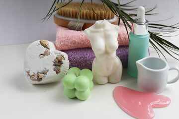 spa theme. pastel colored towels, aroma candles, massagers and spa accessories