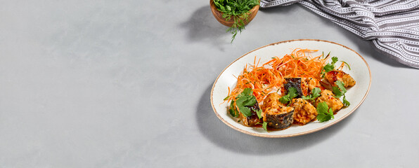 Traditional chinese dish - crispy eggplant with sweet chili sauce. Vegan food - stir fried eggplant with vegetables. Crispy aubergine with chilli sauce on ceramic plate. Modern asian food.