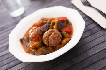 steamed meatballs with stewed vegetables on plate