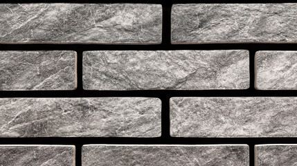 Brickwork made of bricks made to look like natural stone. Dark gray marble granite wall. Cladding of the facade of the building as a lantern made of natural stone. texture wallpaper