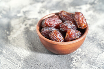 Bowl with dry dates. Top view heap. Healthy sweet snacks. Islamic turkish appetizer. Delicious...