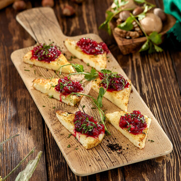 Hot Appetizer For Wine - Grilled Halloumi Cheese With Jam. Cheese Appetizer Baked Halloumi On Wooden Background On Rustic Style. Adyghe Cheese With Berries Dip On Wooden Table.