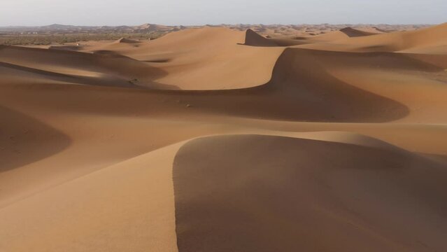 Windy desert sand dunes landscapes in the Sahara desert, Mhamid, Erg Chigaga, Morocco. 4k.