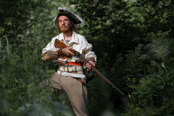 Sea robber ship captain armed pirate goes through jungle. Concept historical halloween. Filibuster...
