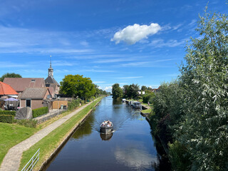 Boat in a canal in the town Kuinre