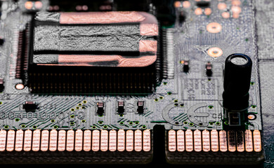 Close up of components and microchips on PC circuit board.