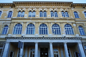 Fototapeta na wymiar Aurelio Saffi school building in Gramsci square in Carrara, Tuscany, Italy